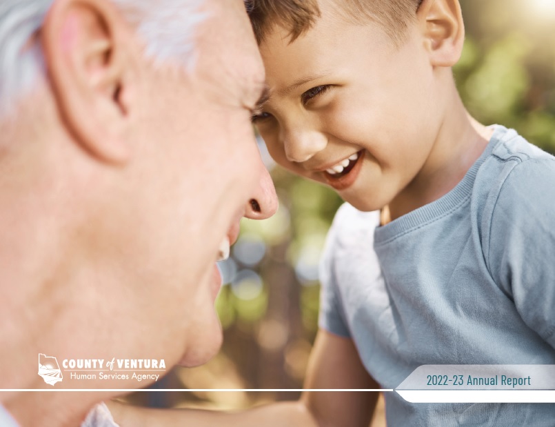 Cover of 2022-23 annual report featuring young boy and senior man holding heads together and smiling